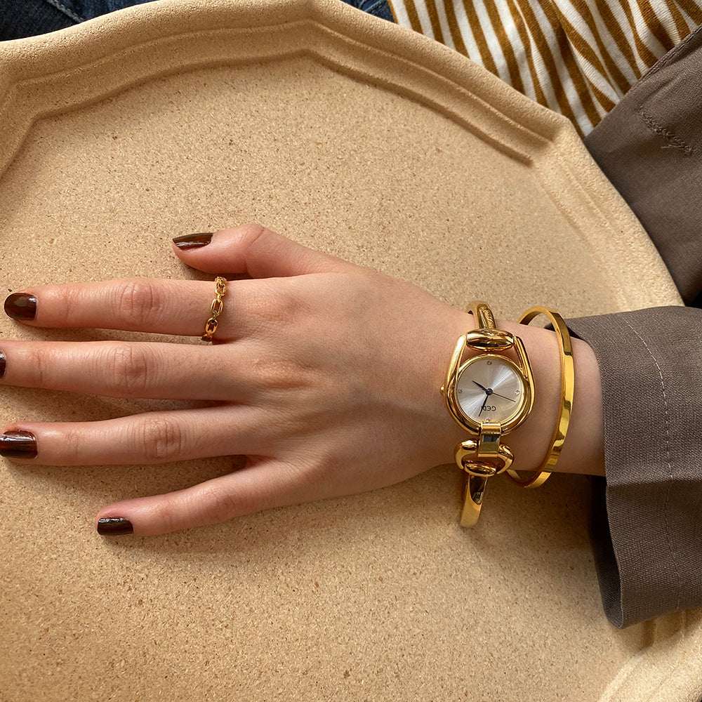 Elegant Gold Bangle Watches | Vintage-Inspired Bracelet Timepieces | Classic Women's Gold Watches | Sophisticated Ladies' Cuff Watches