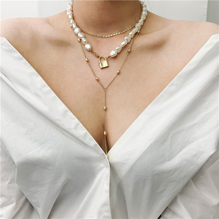 Luxe Layers Jewelry | Chic Chain Boutique | Pearl & Dainty Designs | Elegance Adorned Modern Muse Jewels Metal lock pendant clavicle chain