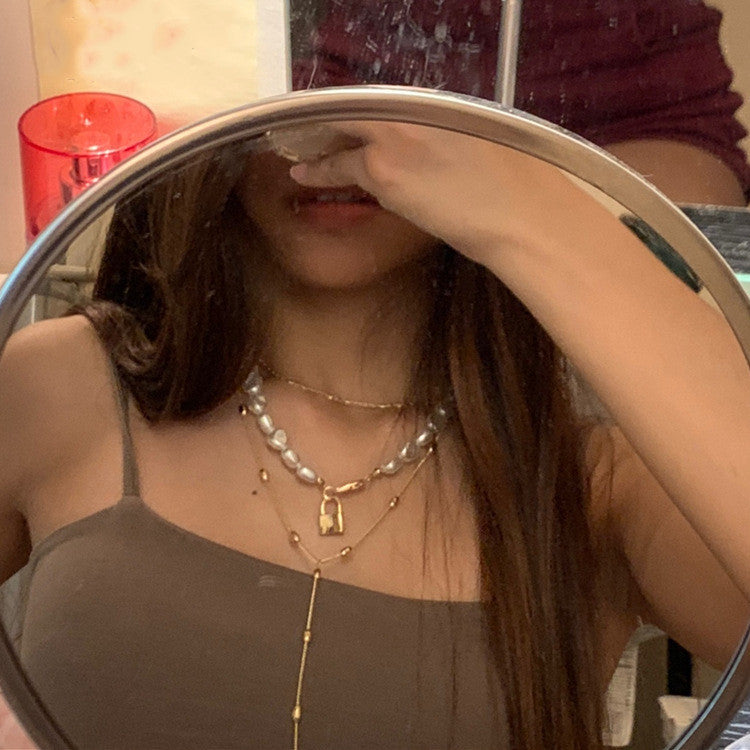 Luxe Layers Jewelry | Chic Chain Boutique | Pearl & Dainty Designs | Elegance Adorned Modern Muse Jewels Metal lock pendant clavicle chain