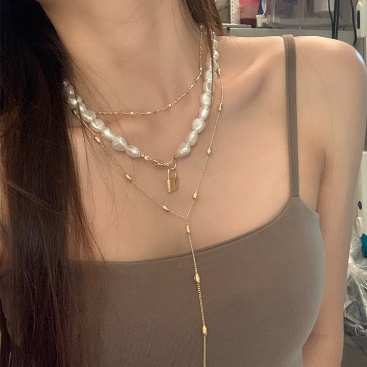 Luxe Layers Jewelry | Chic Chain Boutique | Pearl & Dainty Designs | Elegance Adorned Modern Muse Jewels Metal lock pendant clavicle chain