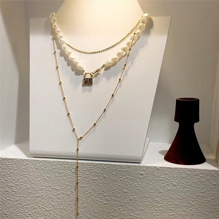 Luxe Layers Jewelry | Chic Chain Boutique | Pearl & Dainty Designs | Elegance Adorned Modern Muse Jewels Metal lock pendant clavicle chain