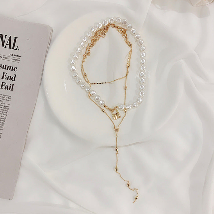 Luxe Layers Jewelry | Chic Chain Boutique | Pearl & Dainty Designs | Elegance Adorned Modern Muse Jewels Metal lock pendant clavicle chain